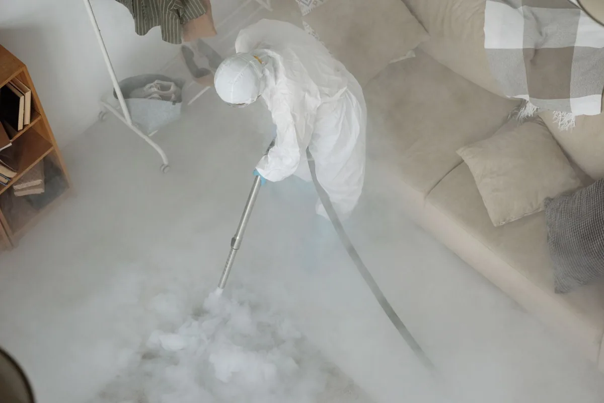 Biohazard cleanup technician in protective equipment, Santa Anna, TX